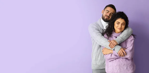 Happy Young Couple Autumn Sweaters Lilac Background Space Text — Stockfoto