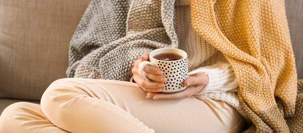 Young Woman Drinking Hot Beverage While Sitting Sofa Home Closeup — Foto de Stock