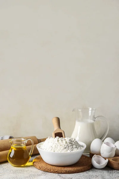 Ingredients for baking on table against light background