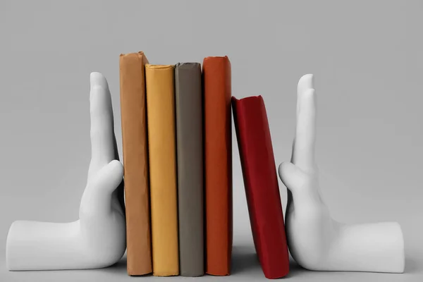 Books Stands Shape Hands Grey Background — Stockfoto