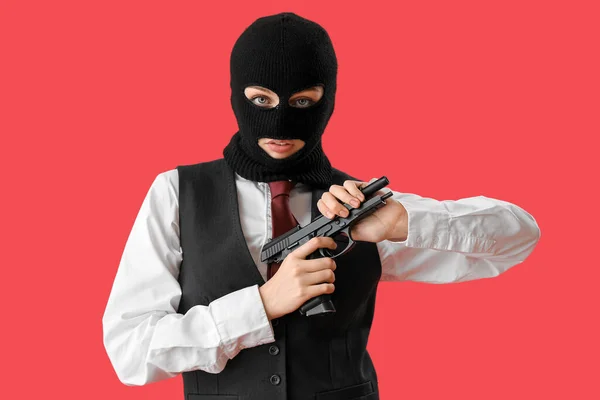Young Woman Balaclava Reloading Gun Red Background — Stock Photo, Image