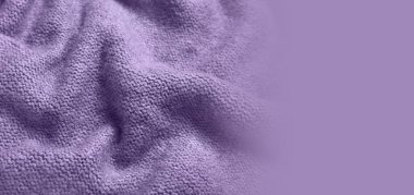 Texture of violet knitted fabric as background. Banner for design