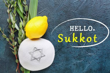 Greeting card with Sukkot festival symbols on dark background