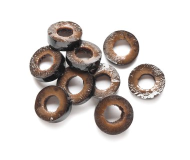 Heap of cut black olives on white background