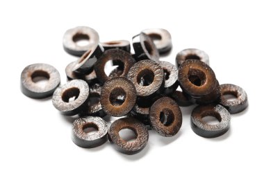 Heap of cut black olives on white background