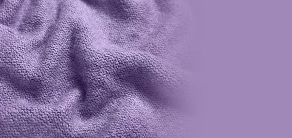 Texture of violet knitted fabric as background. Banner for design