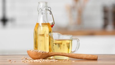 Sunflower oil and seeds on kitchen table