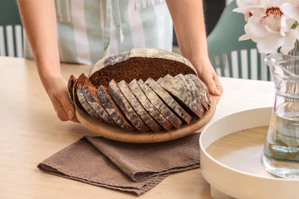 Woman Putting Board Sliced Bread Table Kitchen Closeup — Stock Fotó