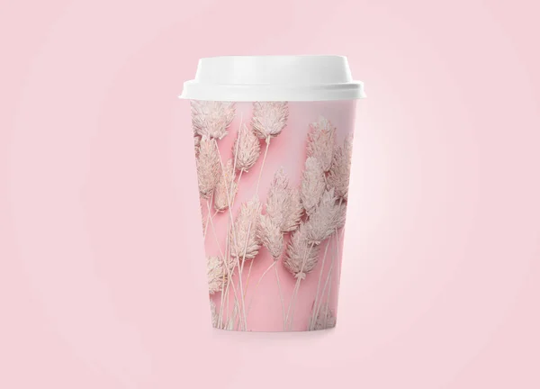 Takeaway cup for drink with floral print on pink background