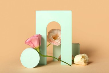 Plaster decor with eustoma flowers on color background
