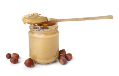 Jar of tasty hazelnut butter on white background