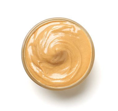 Bowl of tasty nut butter on white background