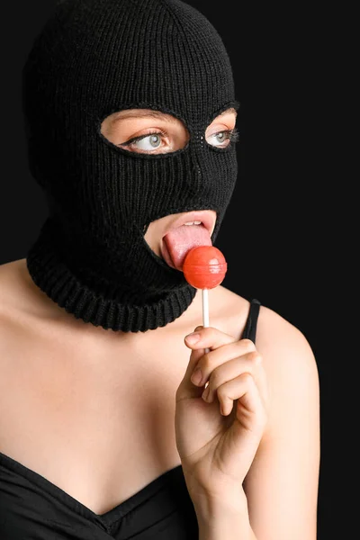 Young Woman Balaclava Licking Lollipop Black Background — Stock Photo, Image