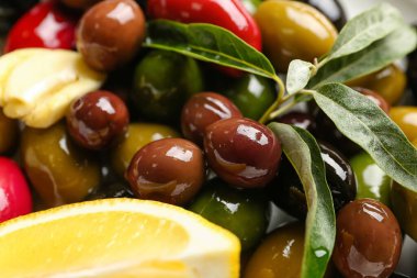 Different kinds of tasty olives, closeup
