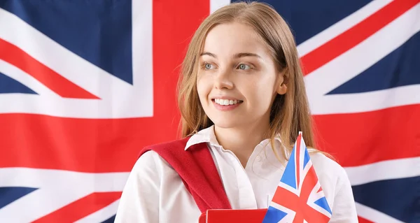 Pretty young woman against UK flag