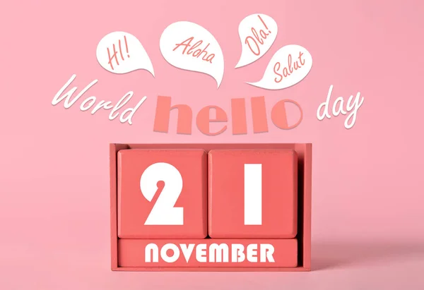 Greeting card for World Hello Day on pink background