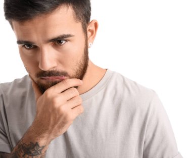 Portrait of worried bearded man isolated on white