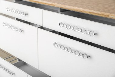 Open empty drawers in kitchen, closeup