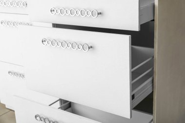 Open empty drawers in kitchen, closeup