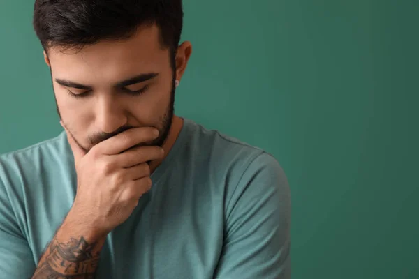 Portrait Thoughtful Bearded Man Tattoo His Arm Green Background — Stock Photo, Image