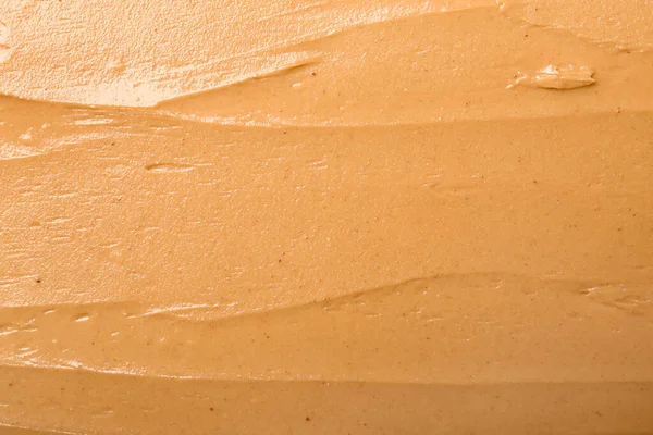 Texture of nut butter as background, closeup