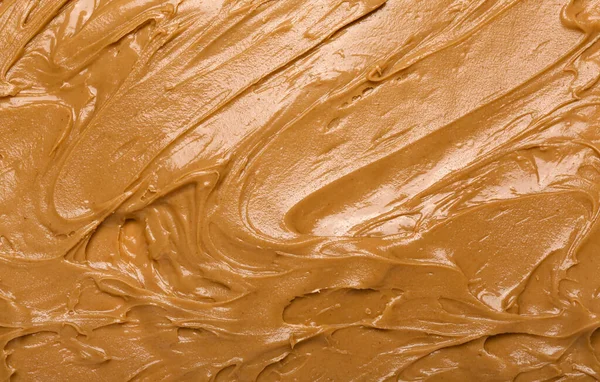 Texture of nut butter as background, closeup