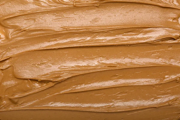 Texture of nut butter as background, closeup
