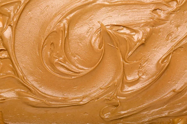 Texture of nut butter as background, closeup