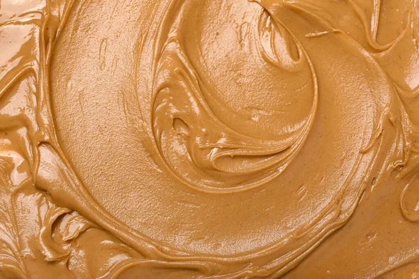 Texture of nut butter as background, closeup