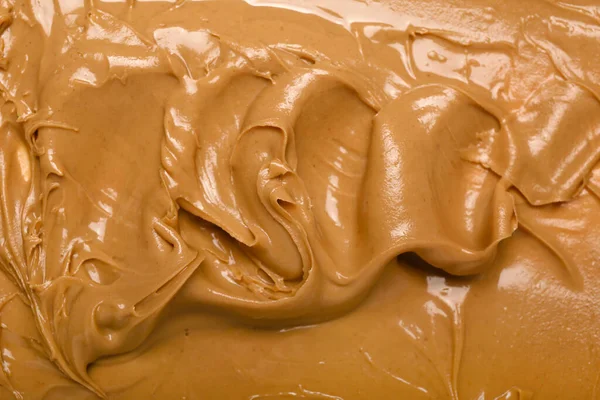 Texture of nut butter as background, closeup