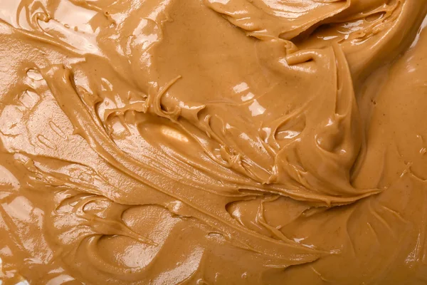 Texture of nut butter as background, closeup