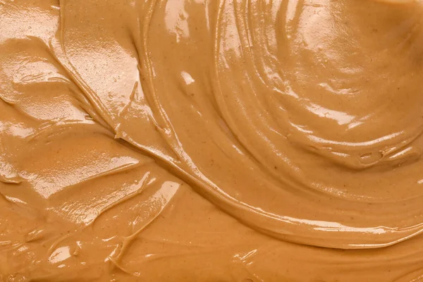 Texture of nut butter as background, closeup