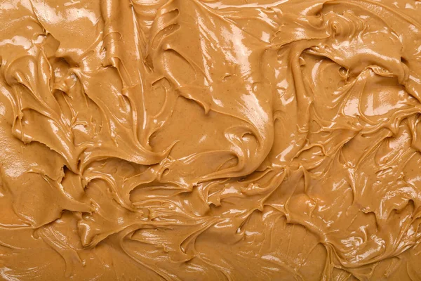 Texture of nut butter as background, closeup