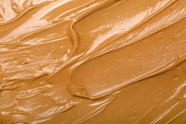 Texture of nut butter as background, closeup