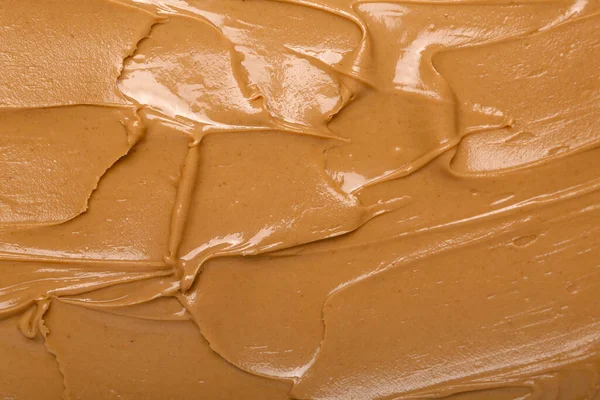 Texture of nut butter as background, closeup