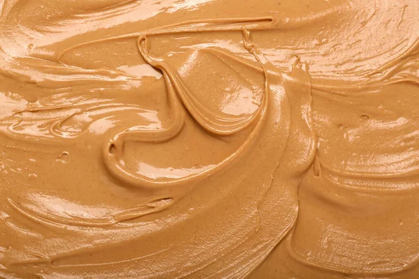 Texture of nut butter as background, closeup