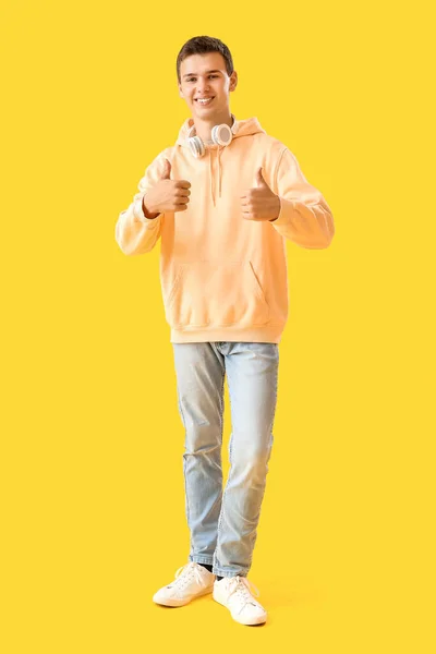 Teenage Boy Headphones Showing Thumbs Yellow Background — Stock Photo, Image