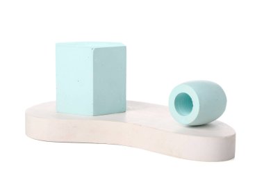 Different decorative podiums for presentation of cosmetic products on white background