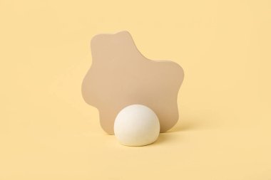 Empty showcase pedestals on color background