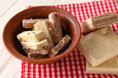 Bowl of sweet sesame halva on table, closeup