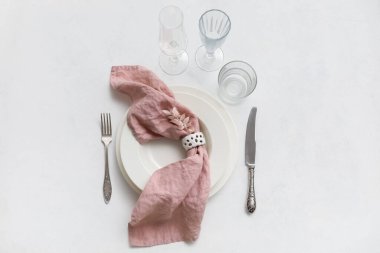 Simple table setting with decor on white background