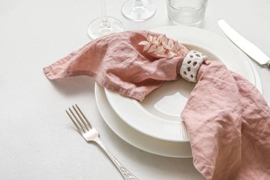 Dinnerware with decor on white table, closeup