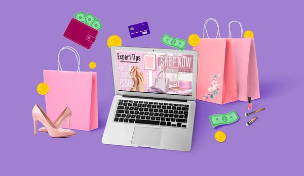 Laptop, bags, credit card and money on violet background. Online shopping concept