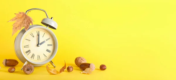 Alarm Clock Autumn Leaves Nuts Yellow Background Space Text — Stockfoto