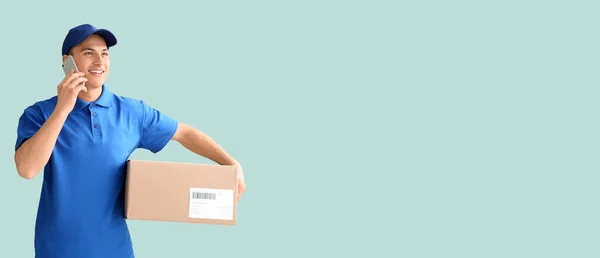 Delivery Man Parcel Talking Phone Light Blue Background Space Text —  Fotos de Stock