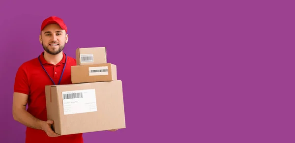 Handsome Delivery Man Parcels Violet Background Space Text — Stok fotoğraf