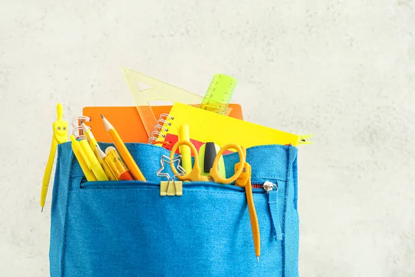 Blue Backpack School Stationery Light Background Closeup — Φωτογραφία Αρχείου