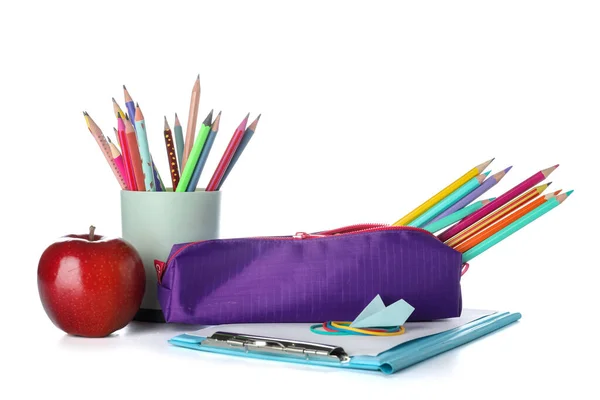 Purple pencil case with school stationery, apple and paper plane on white background