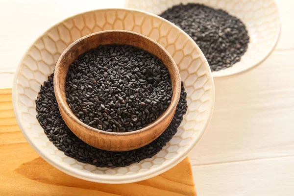 Bowls Black Sesame Seeds Light Wooden Background Closeup — Stock Photo, Image