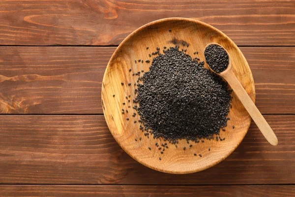 Plate Black Sesame Seeds Wooden Background — Stock Fotó